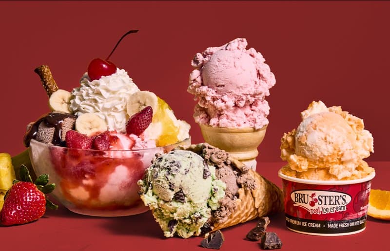 Assorted ice cream sundaes, cones, and cup with logo