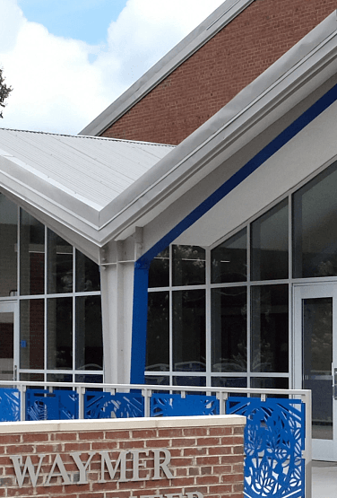 Building exterior with Waymer sign and blue trim