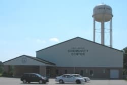 Exterior building with water tower and parked cars