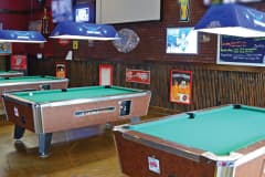 Interior view of pool tables in sports bar