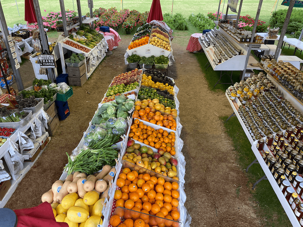 Farmers market produce stand with fruits and vegetables