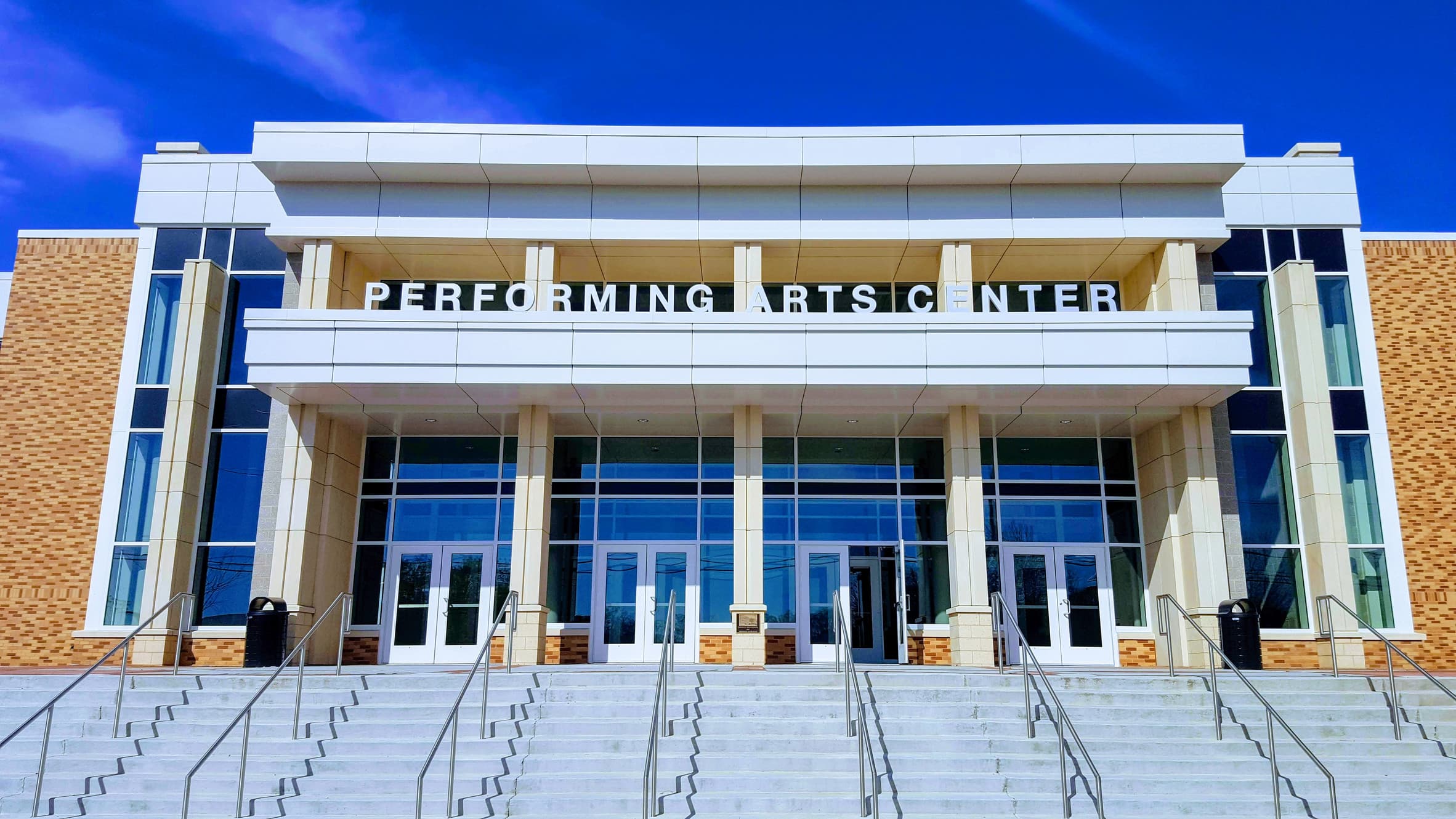 Exterior facade with Performing Arts Center sign and steps