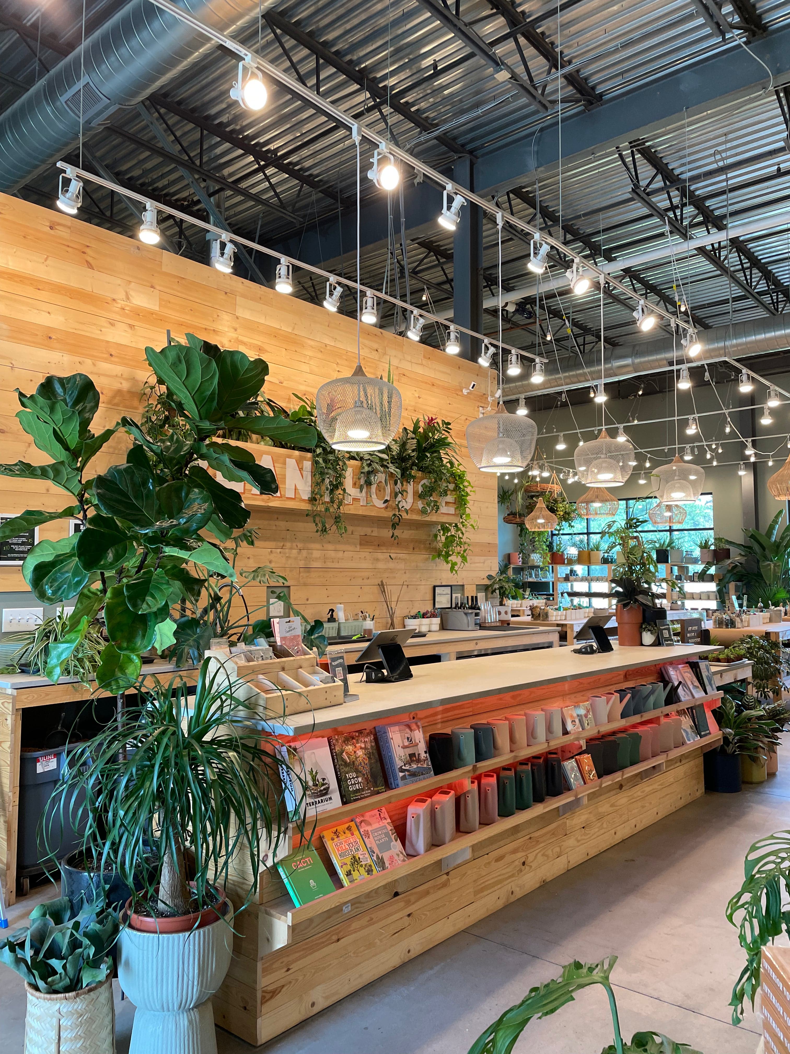 PlantHouse sign with plants and craft workshop tables