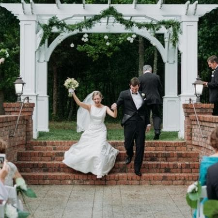 Bride and groom at outdoor wedding ceremony venue