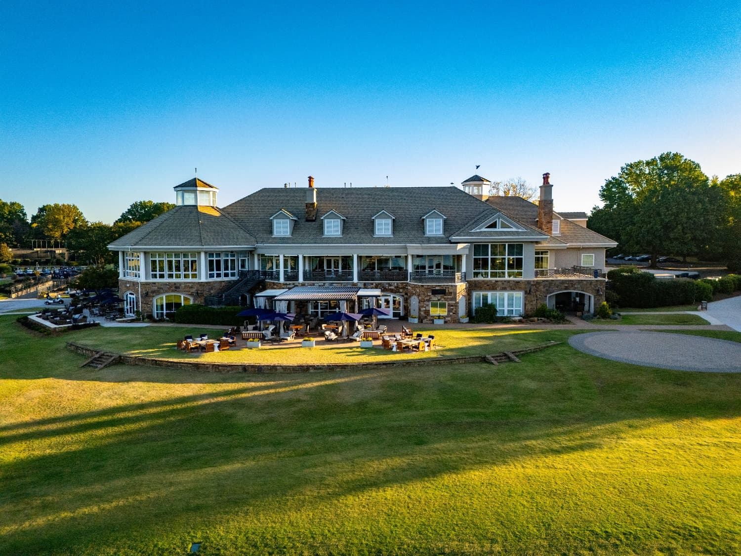 Clubhouse building exterior with patio at golf course