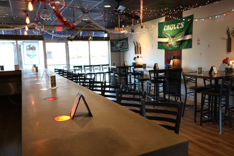 Bar interior with Eagles flag and seating