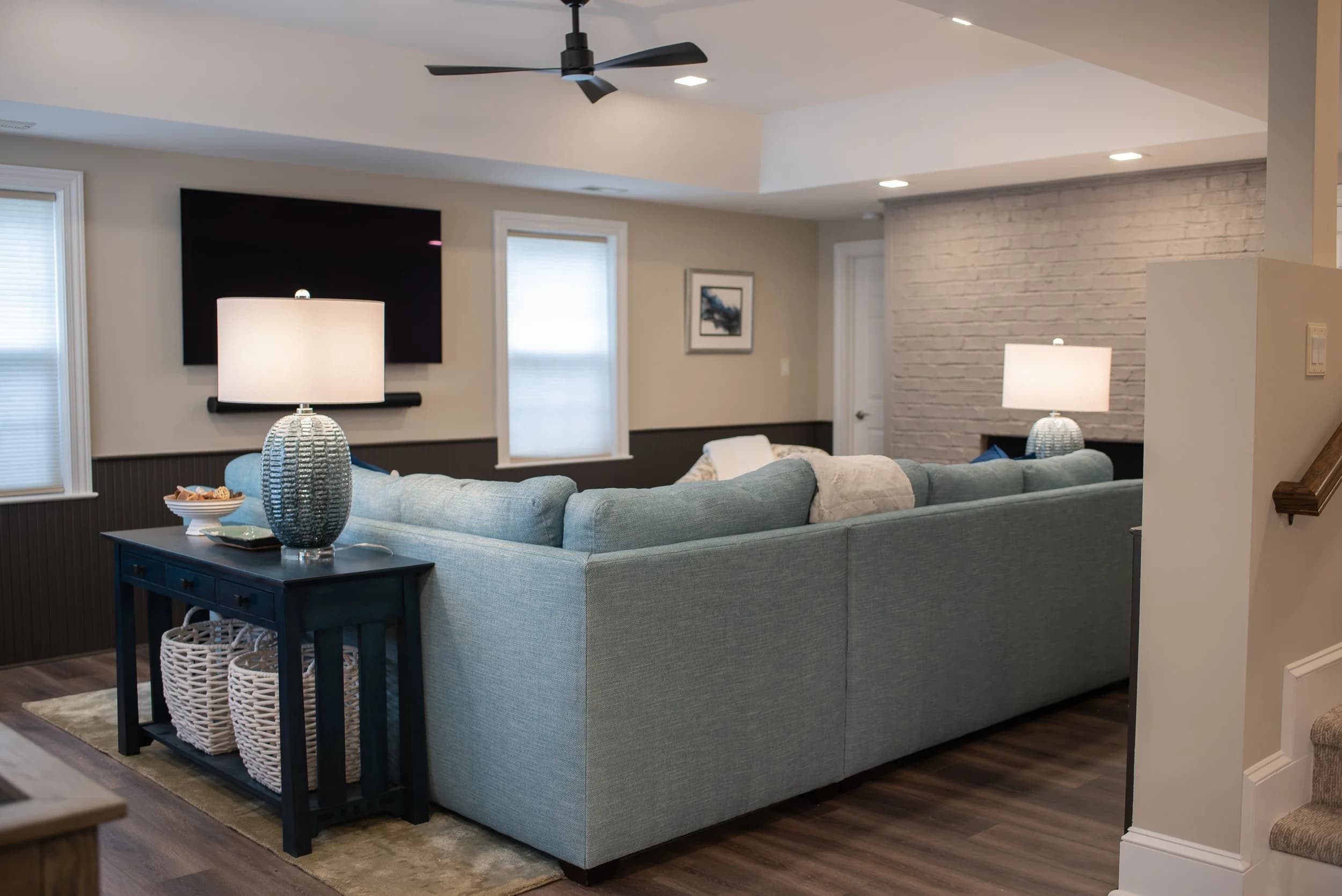 Modern basement living room with seating