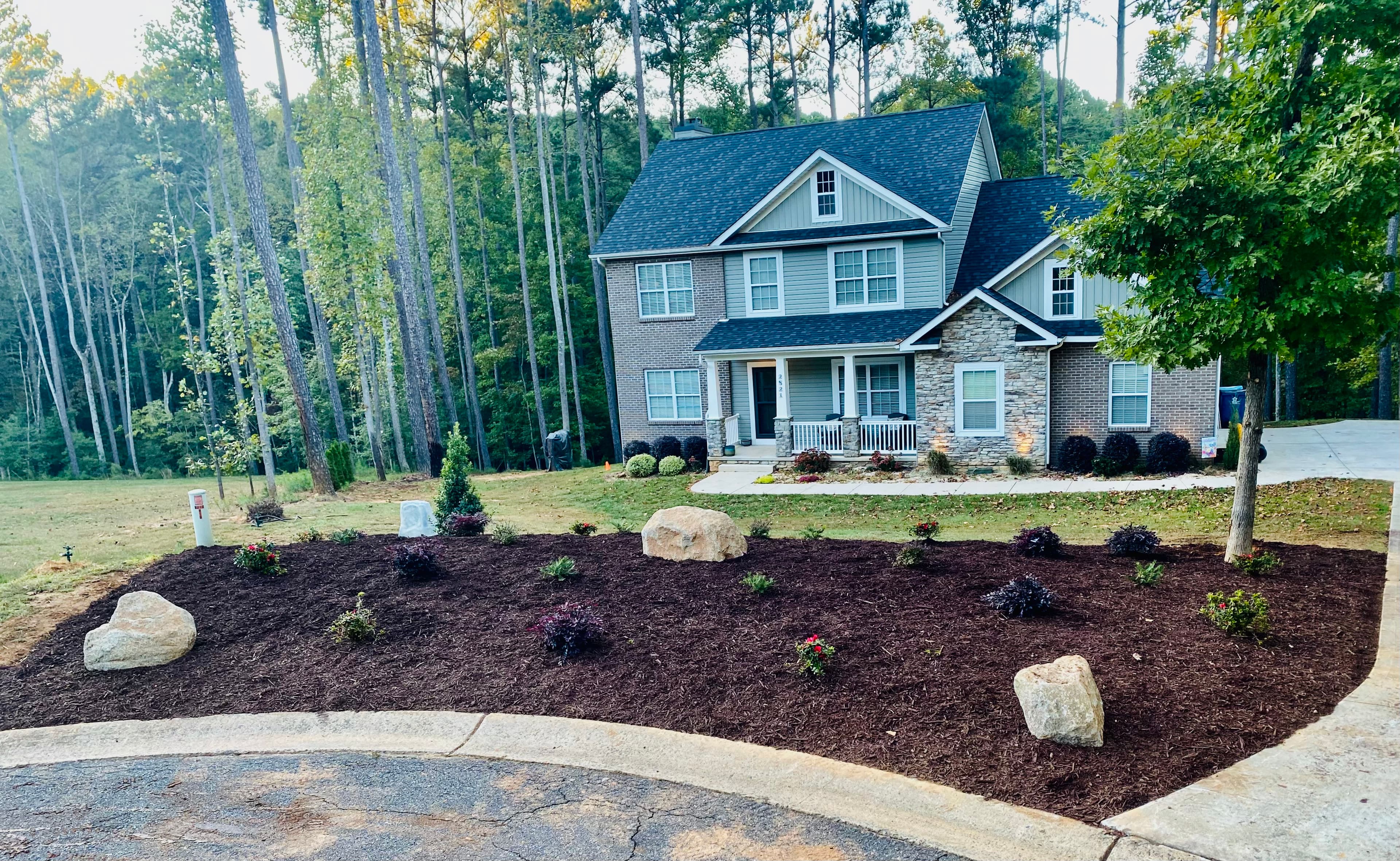 Front yard landscaping with mulch and plants