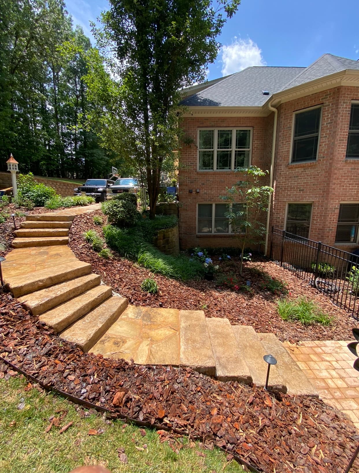 Hardscape pathway with steps and mulch beds
