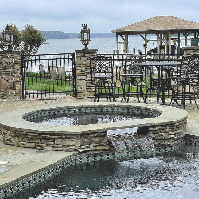 Waterfront patio with fire pit and gazebo