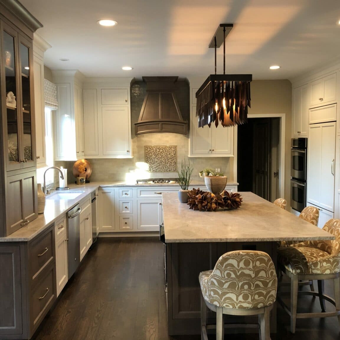Kitchen with white cabinets and island