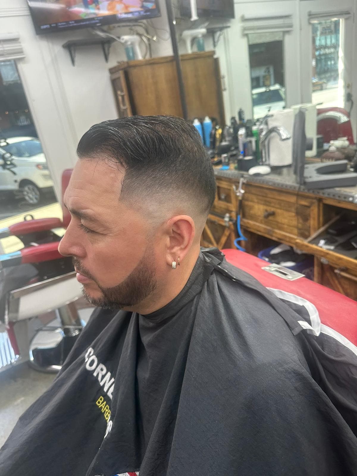 Barber shop interior with brick wall and mirrors
