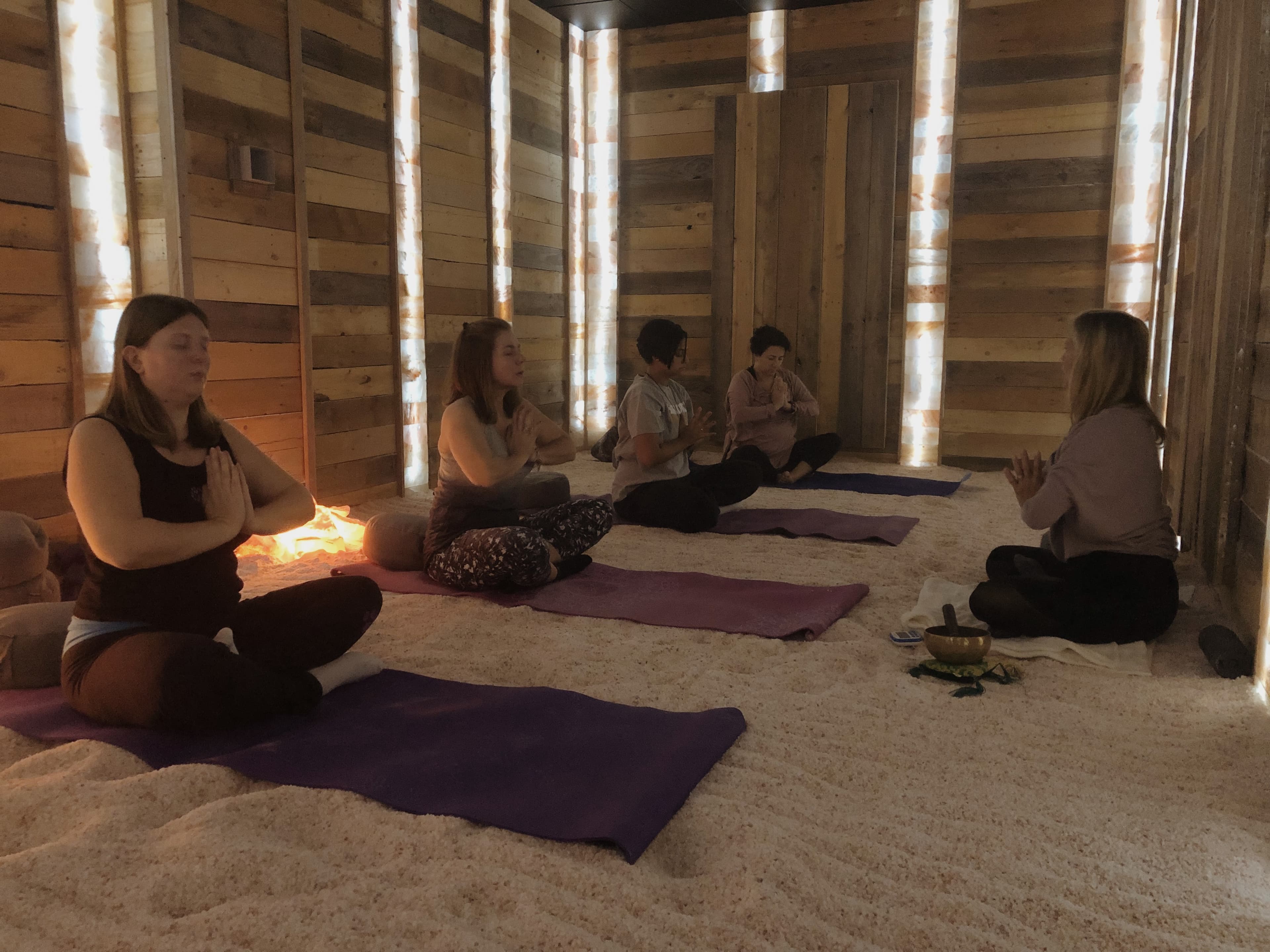 Group meditation/yoga session in salt room