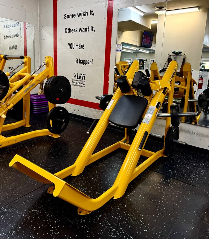 Interior gym with yellow exercise equipment