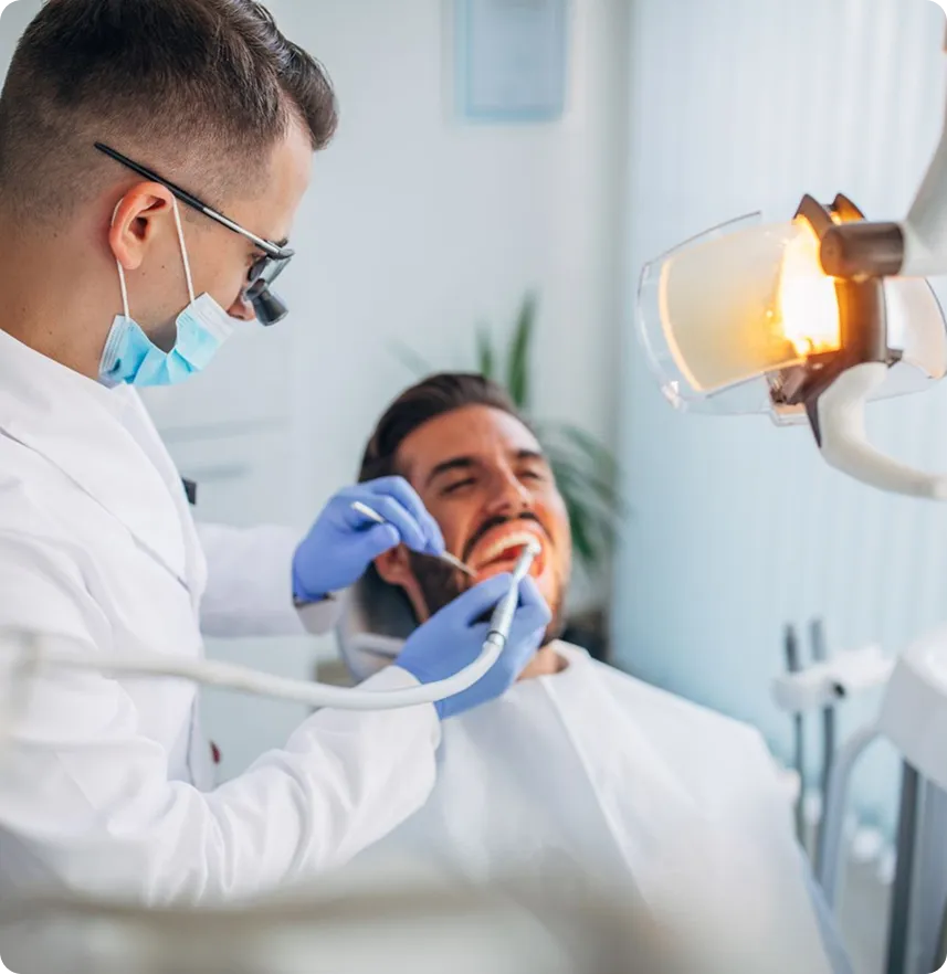 Dentist performing dental examination on patient