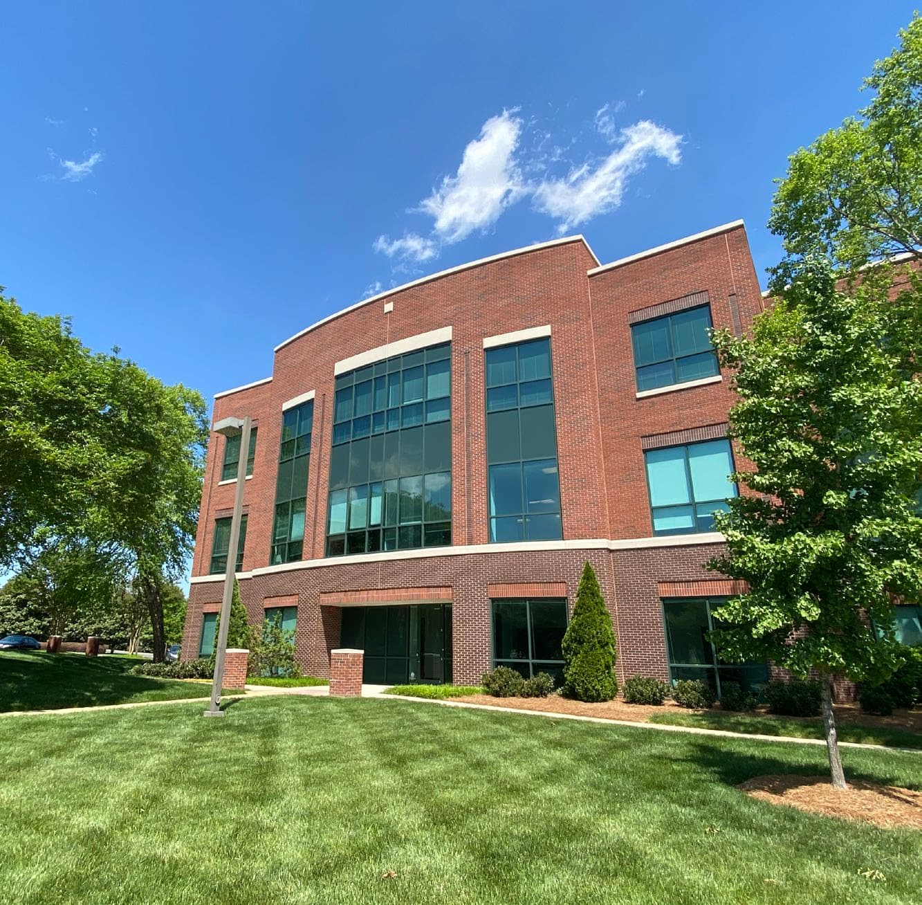 Modern brick building exterior with large windows