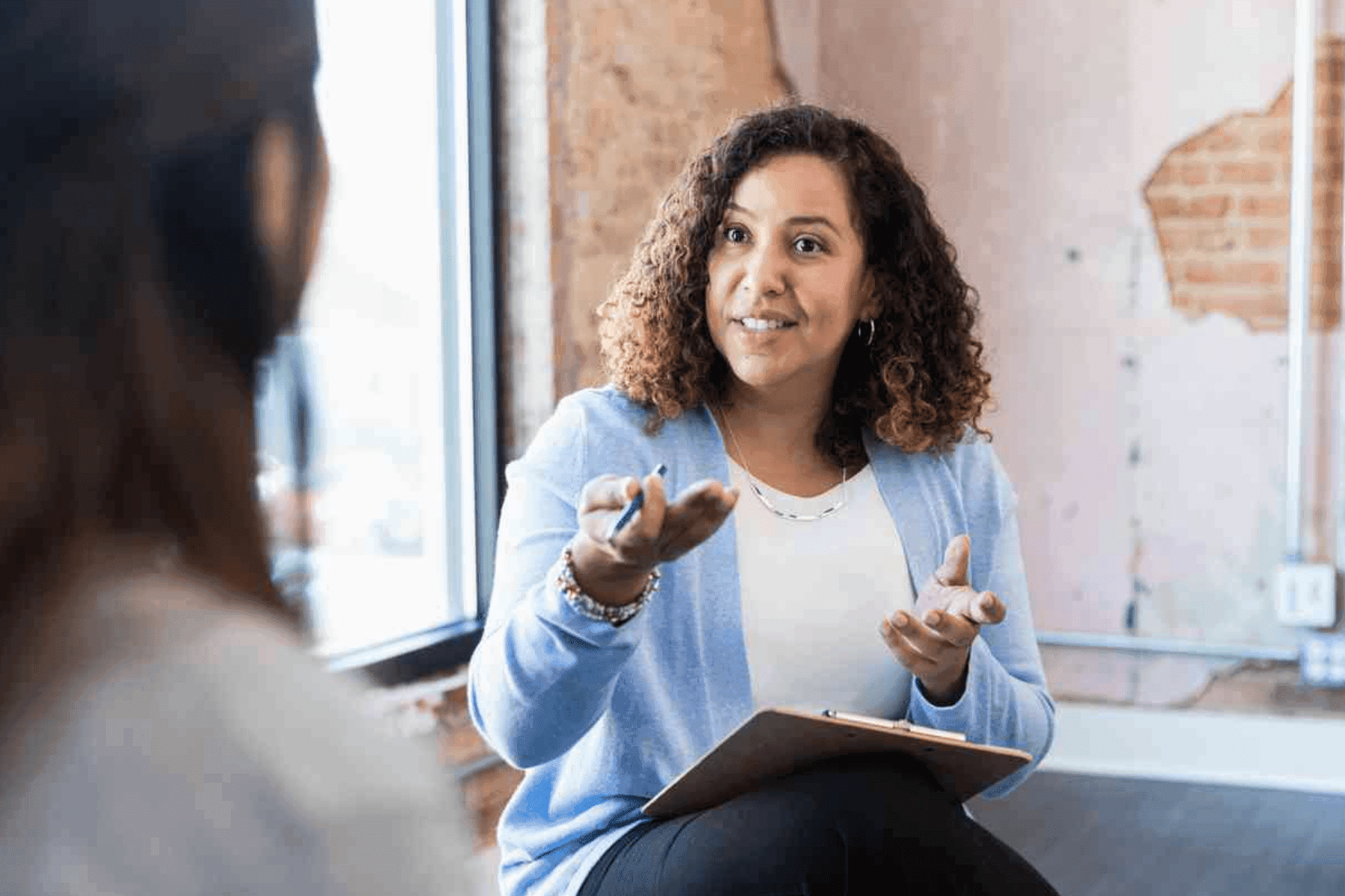 Woman conducting counseling session with client