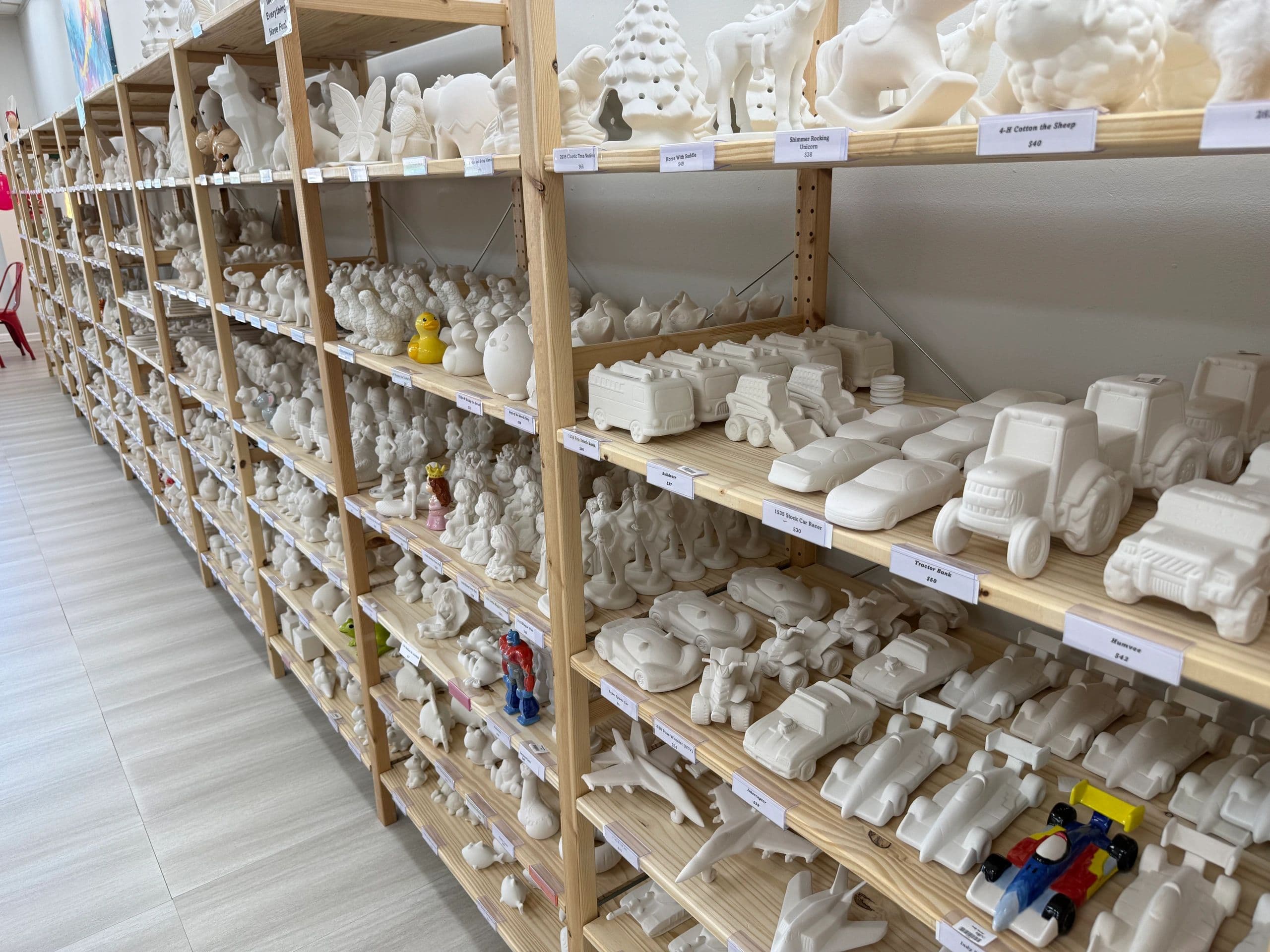 Interior shelving with white ceramic pottery pieces