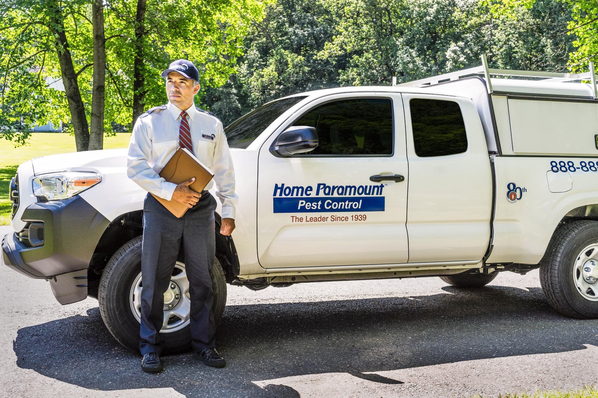 Pest control technician with service vehicle