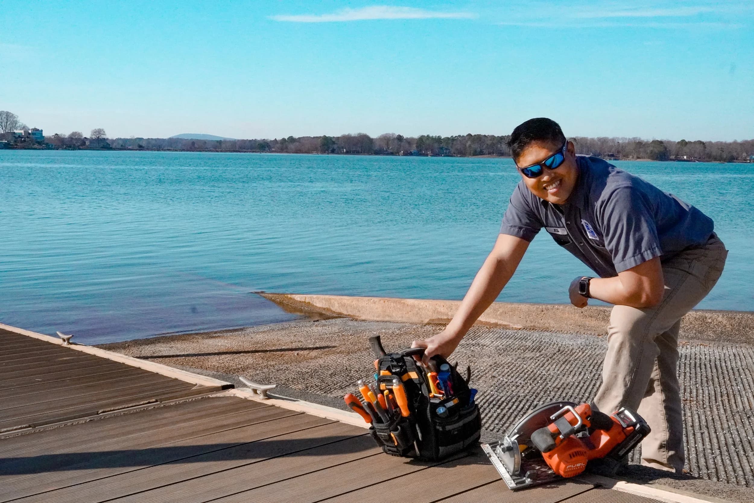 Handyman with tools by waterfront
