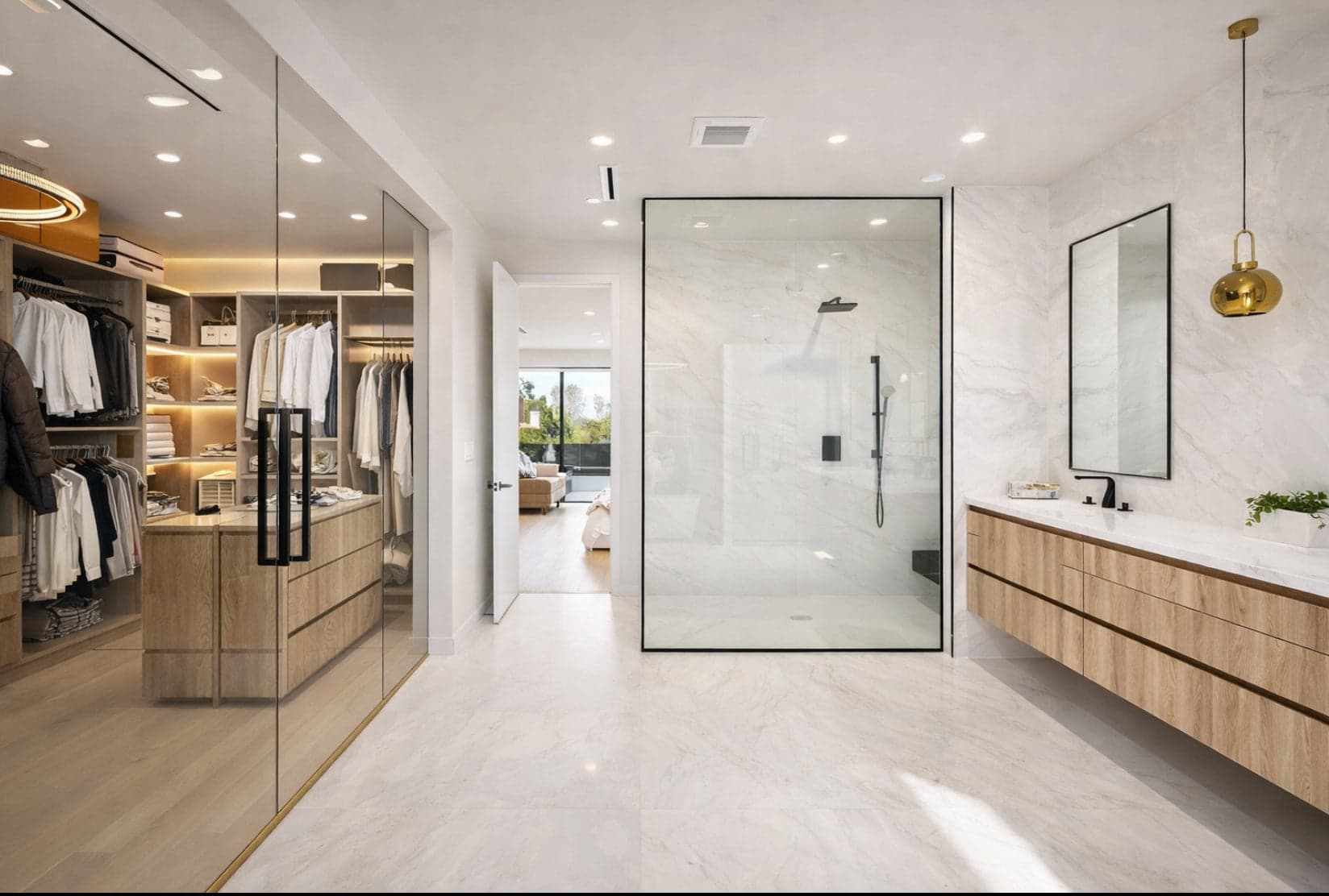 Custom closet with glass doors and wooden cabinetry