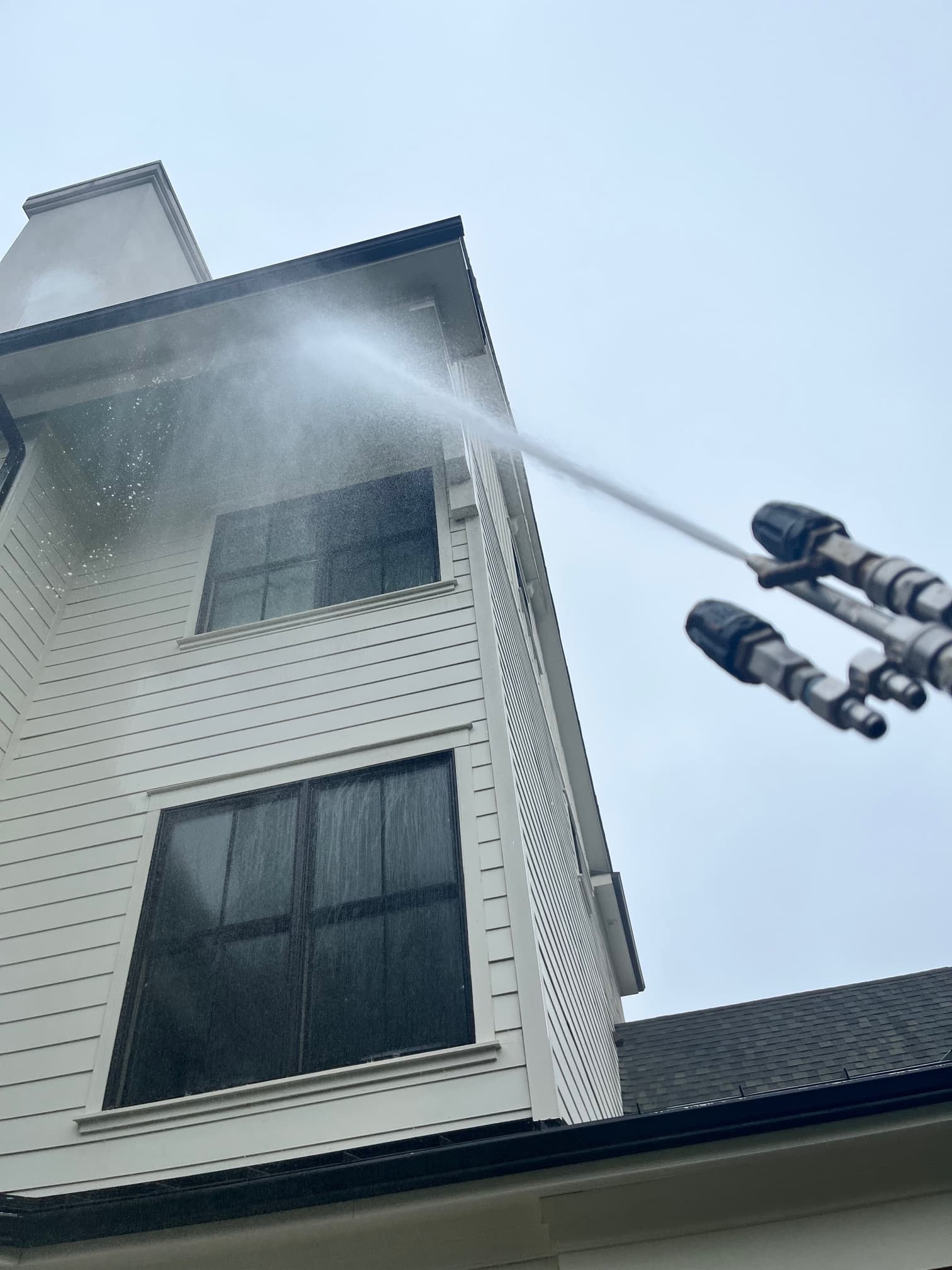 Professional window cleaning service in action