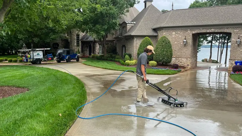 Pressure washing driveway with equipment