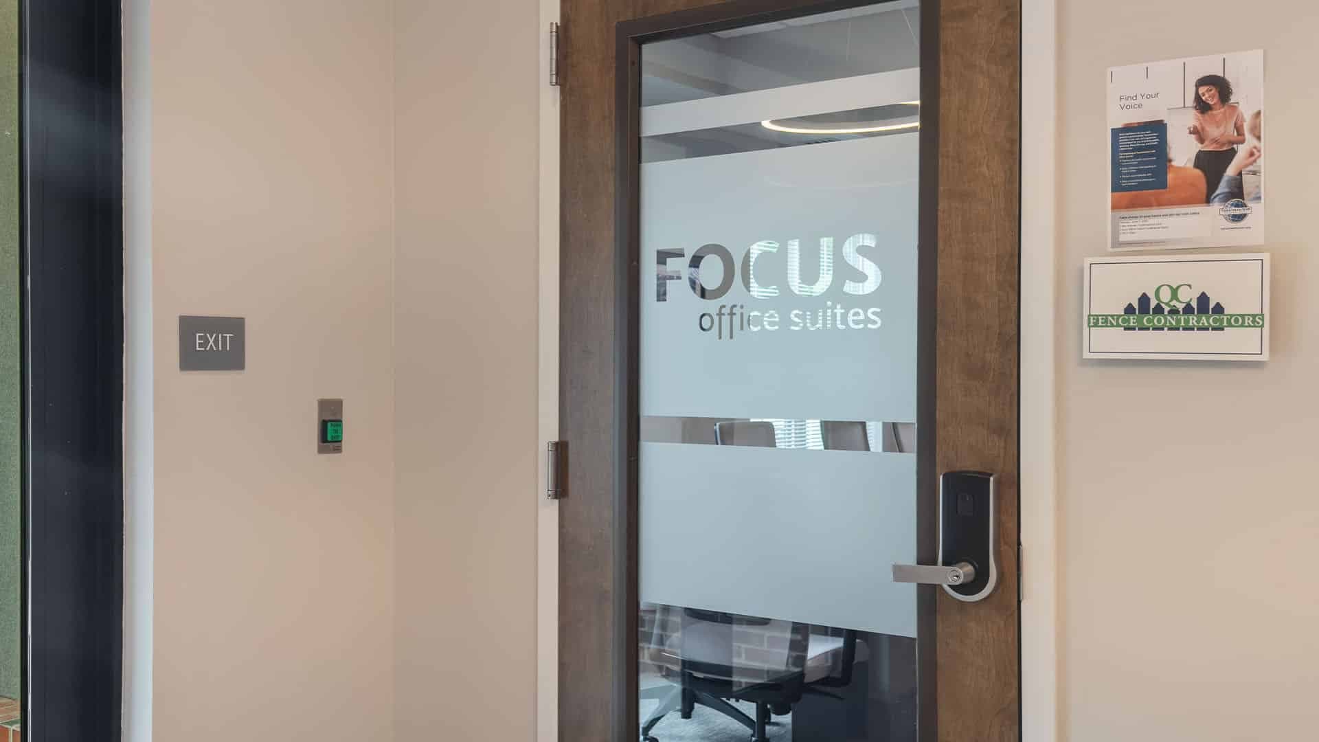 Office interior with QC Fence Contractors signage