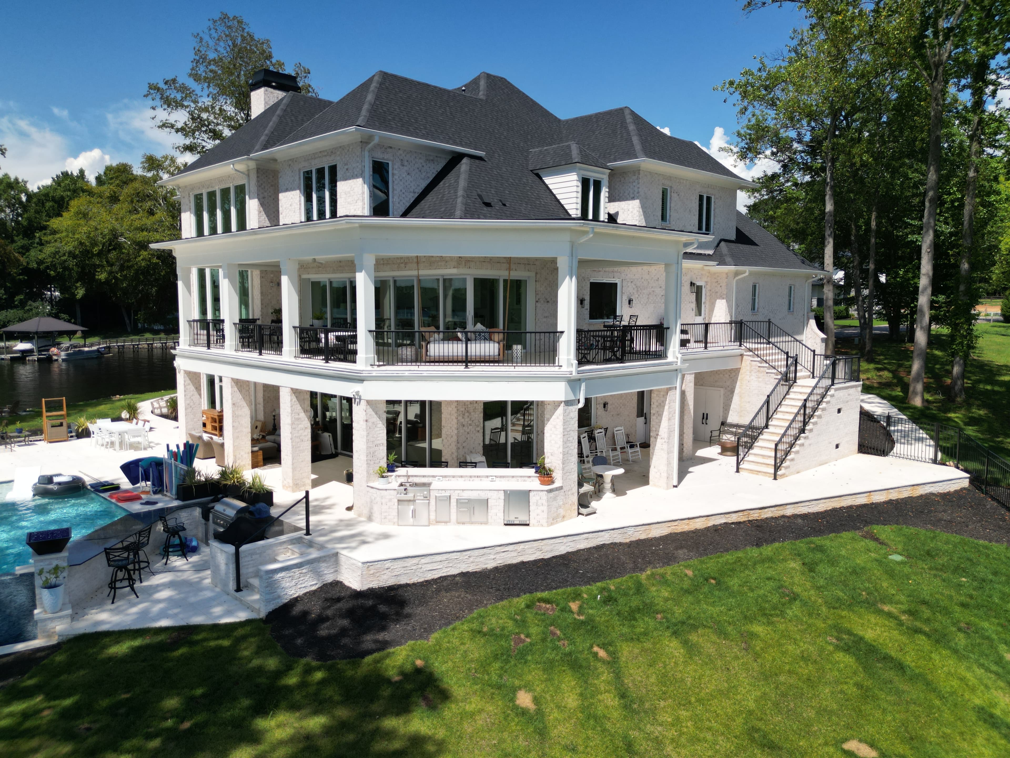 Luxury waterfront home with pool and deck