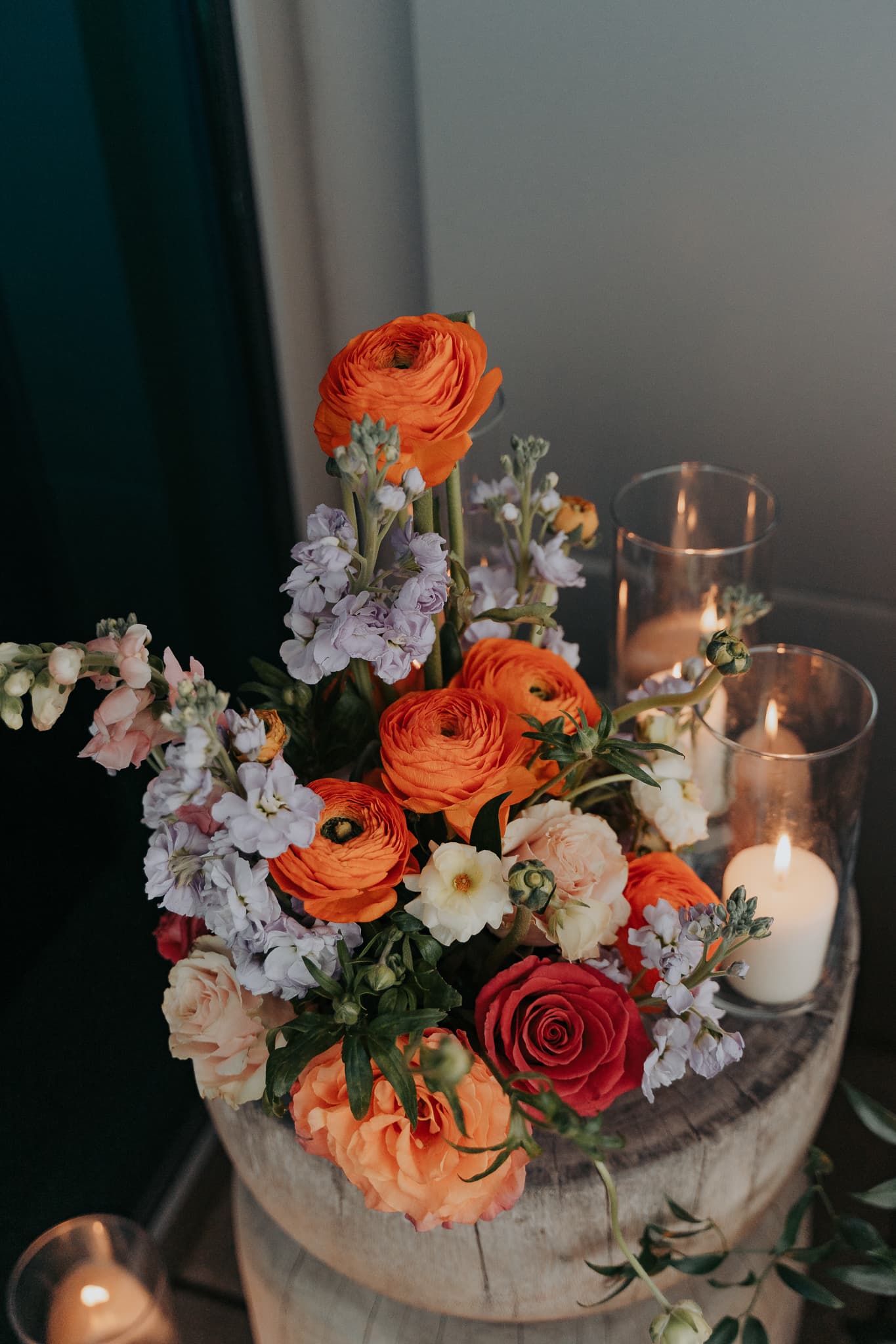 Floral centerpiece arrangement with candles