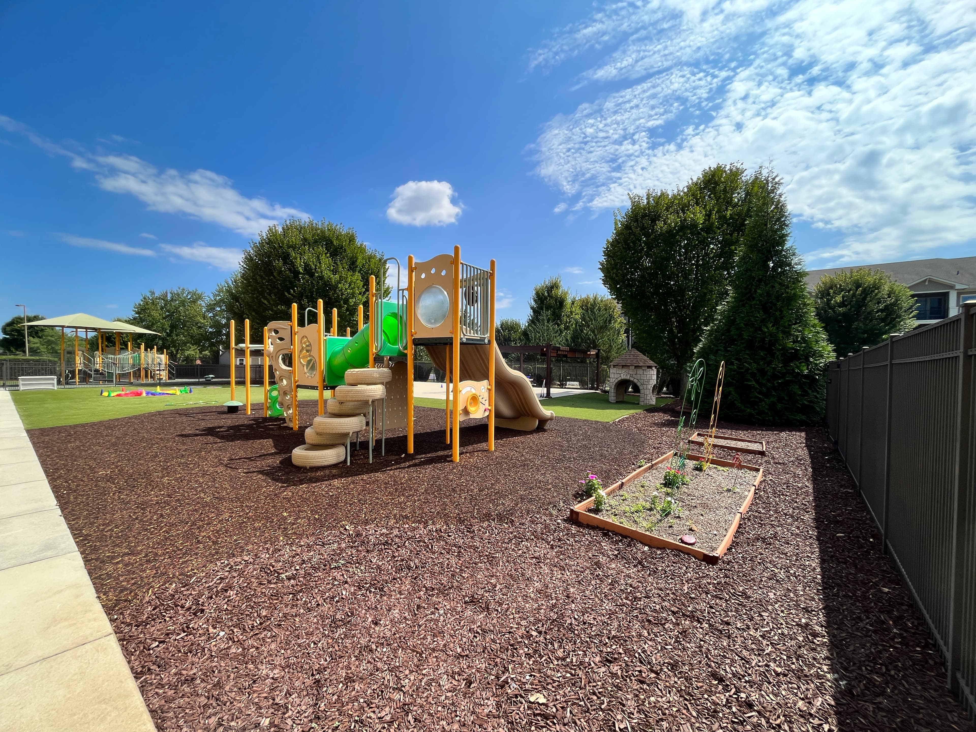 Playground with slide and climbing structure