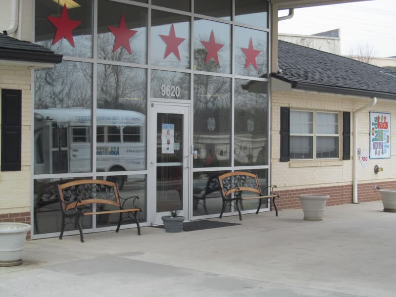 Storefront exterior with red stars and signage