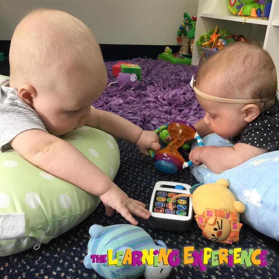 Babies playing with toys at the facility