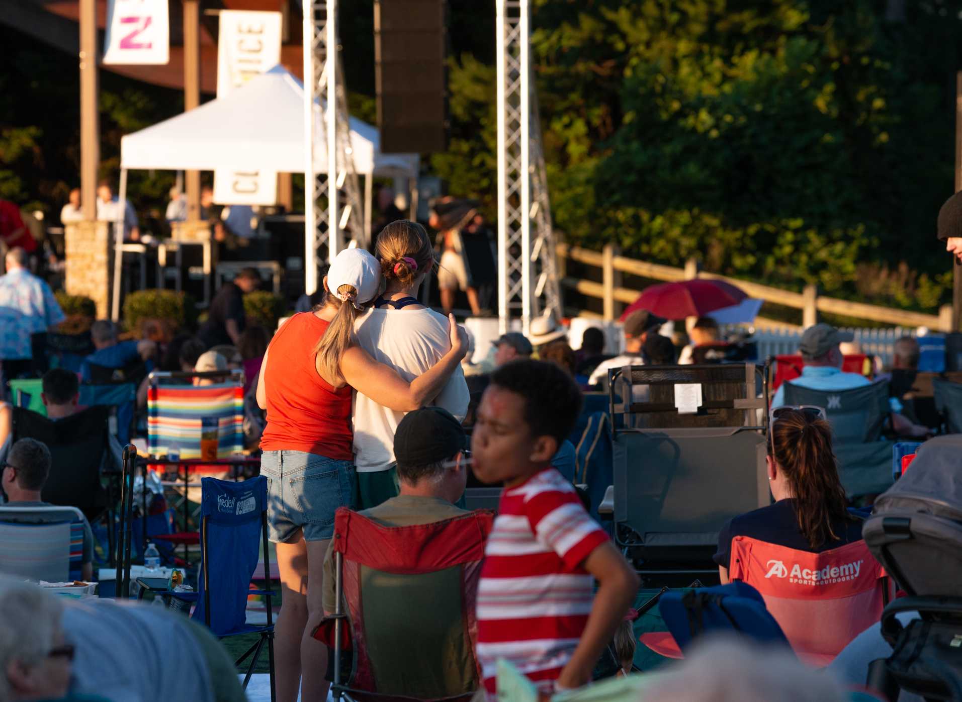 Outdoor evening event with families and activities