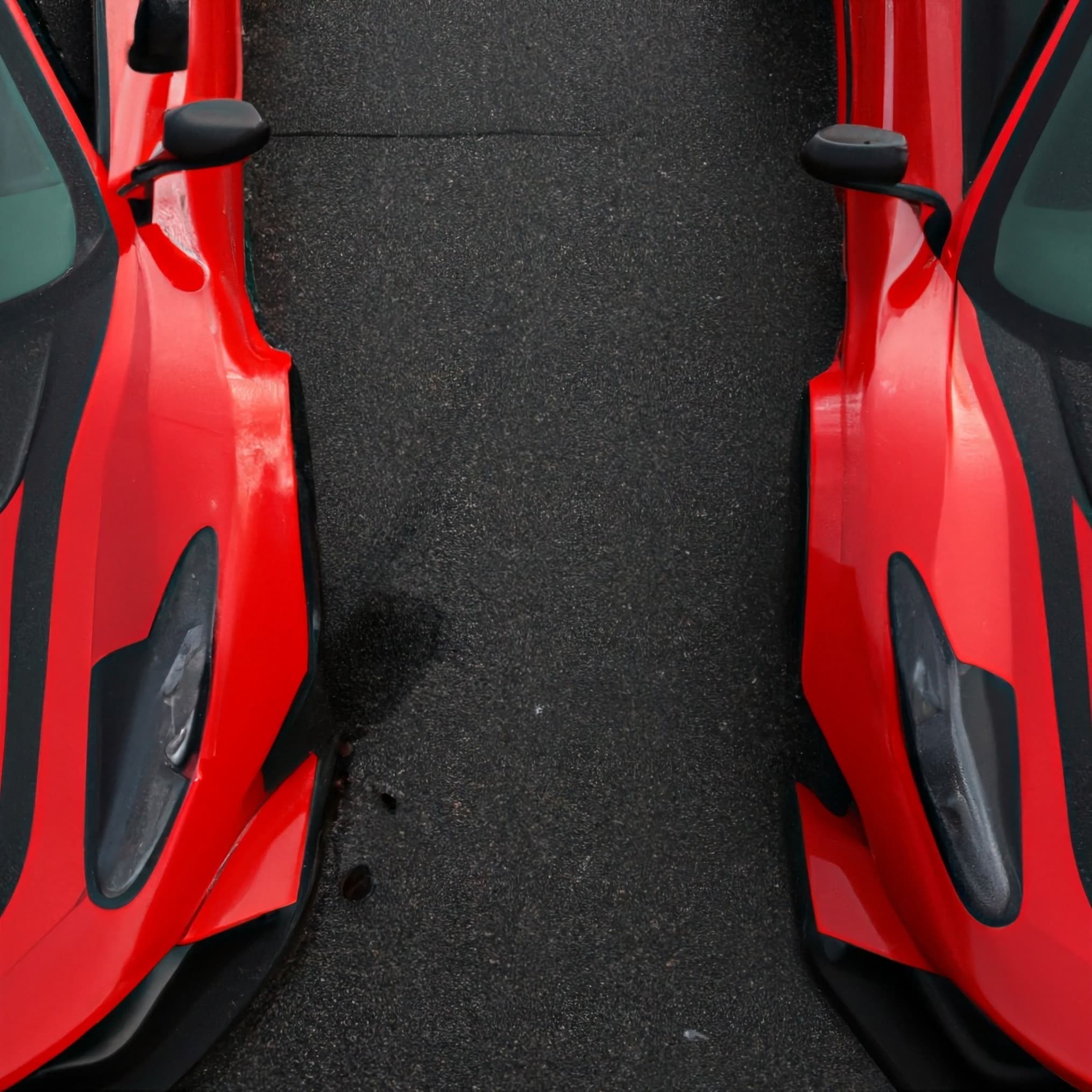 Red vehicle with open doors, detailing work