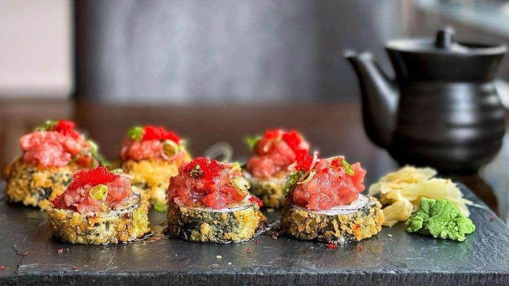 Plated sushi appetizers with tuna topping