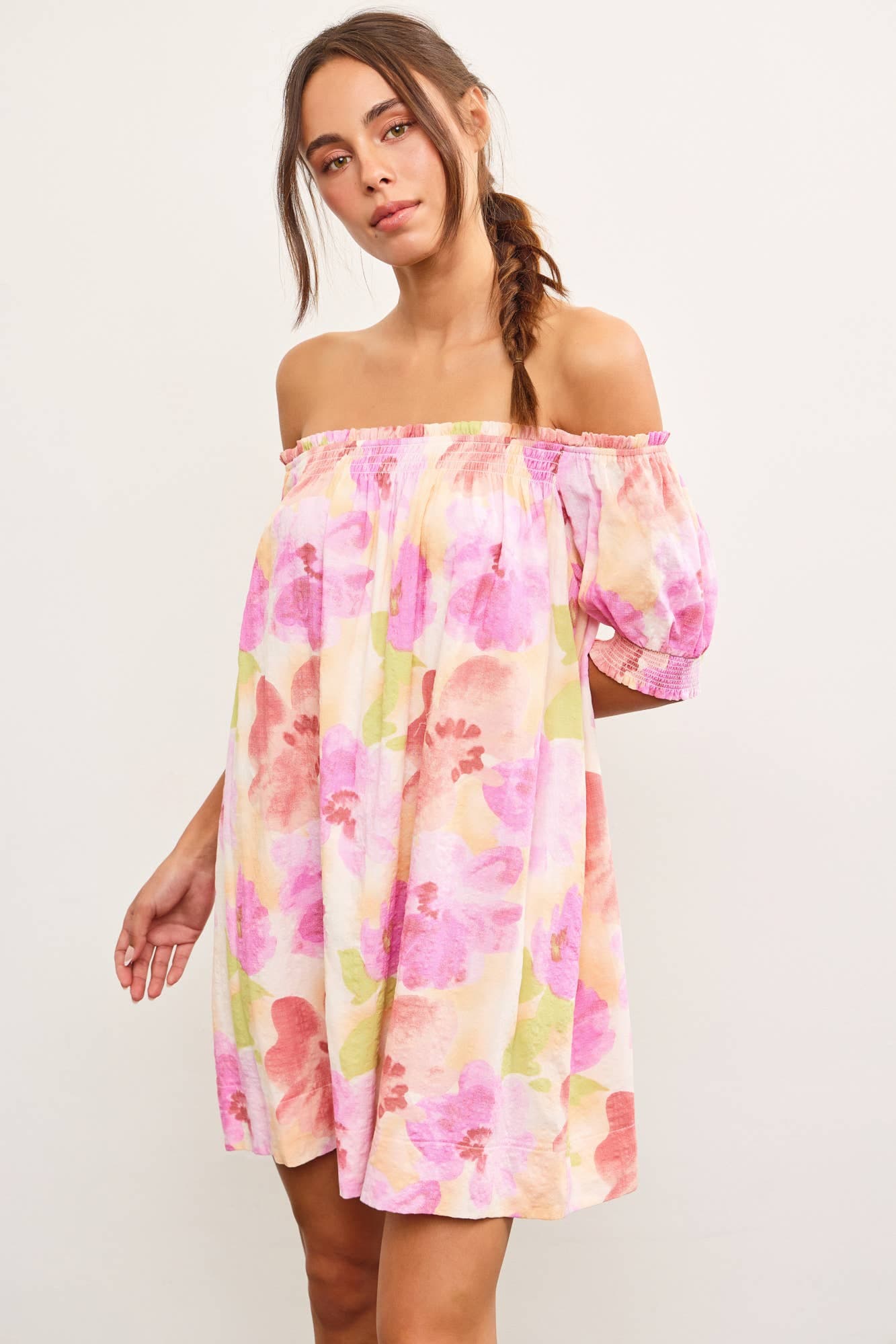 Woman modeling floral off-shoulder dress