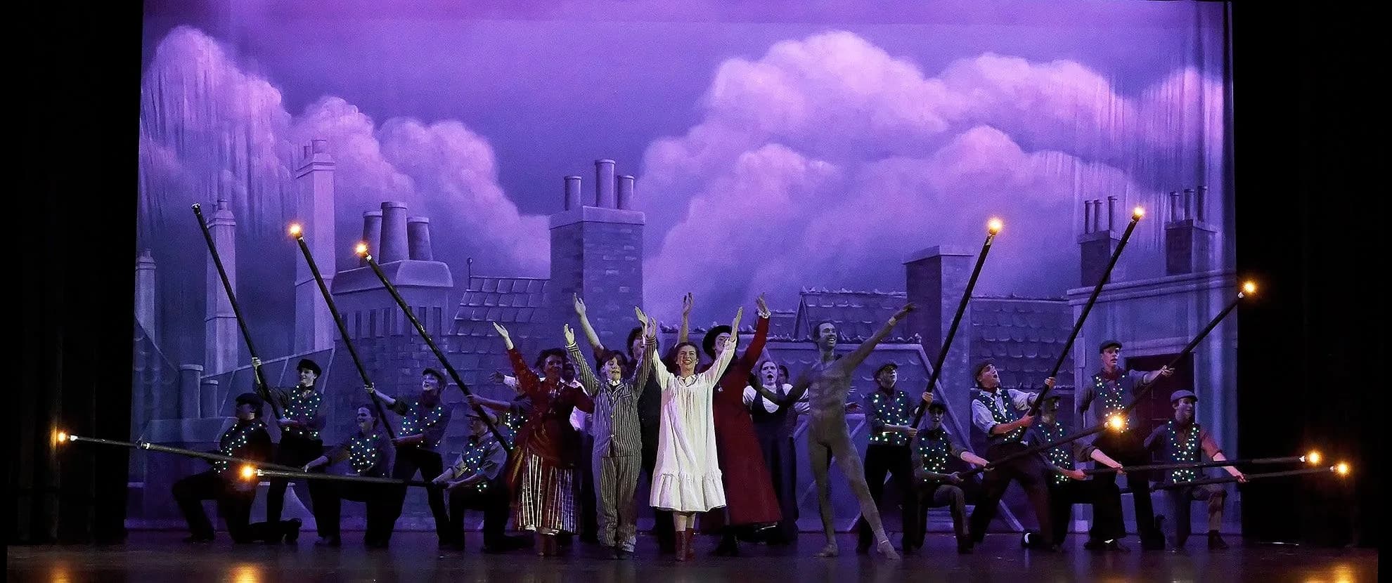 Actors performing on stage in period costumes