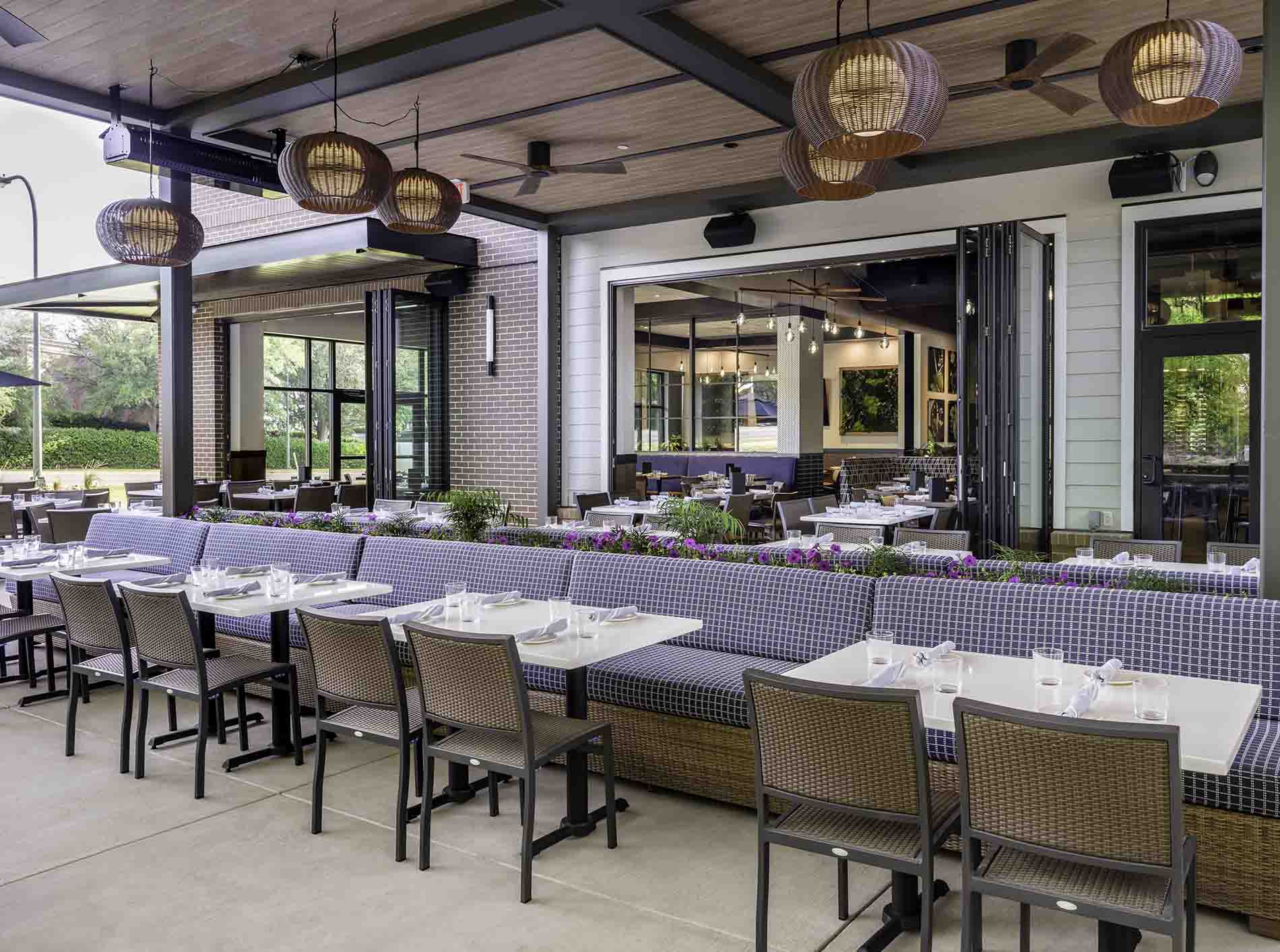 Restaurant patio dining area with tables and lighting