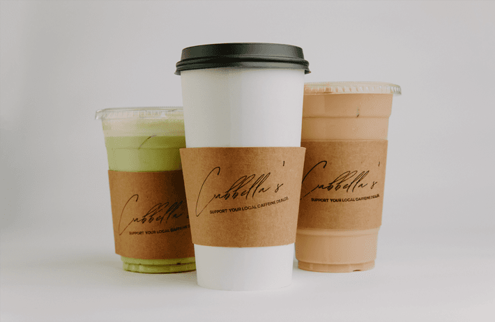 Three branded coffee cups with drinks