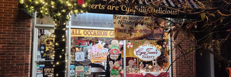 Storefront exterior with bakery signage and window display
