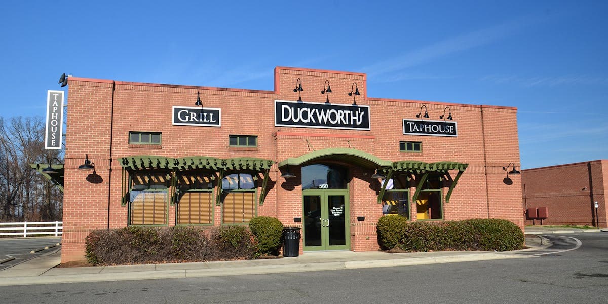 Exterior storefront with Duckworth's Grill & Taphouse signage