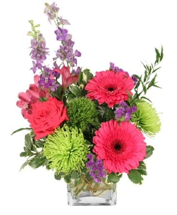 Pink and green flower bouquet in glass vase