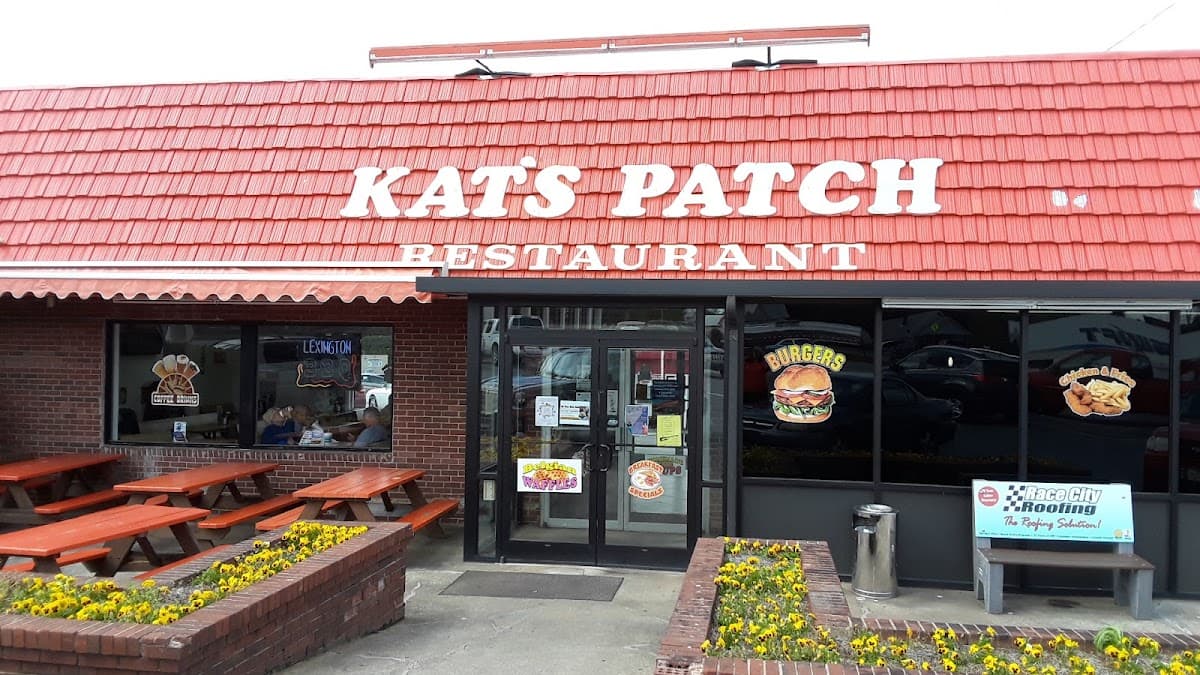 Storefront exterior with Kat's Patch Restaurant sign and patio