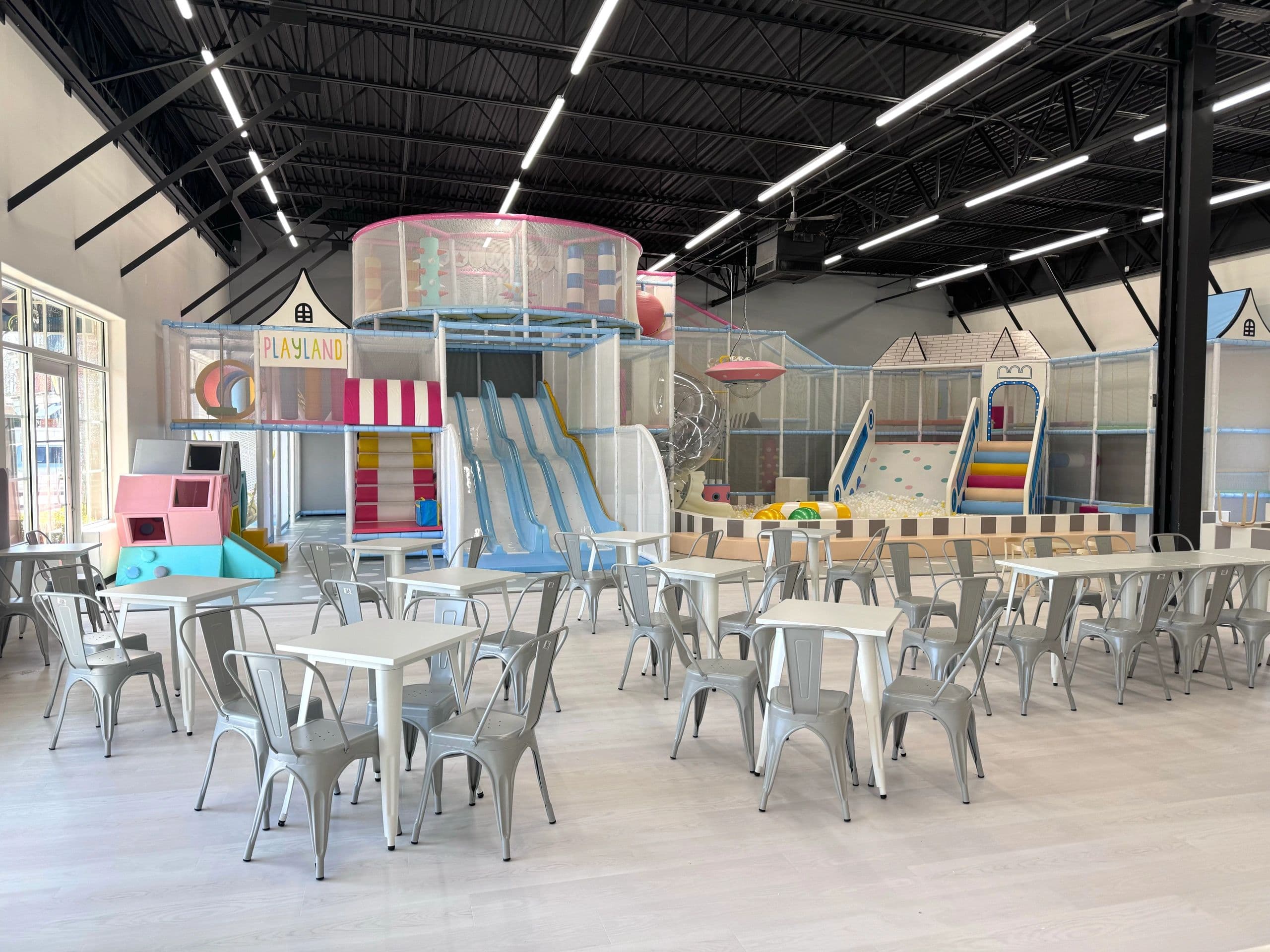 Indoor playground interior with slides, ball pit, seating