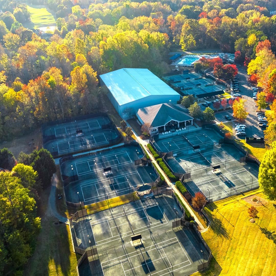 Indoor tennis courts with players in action