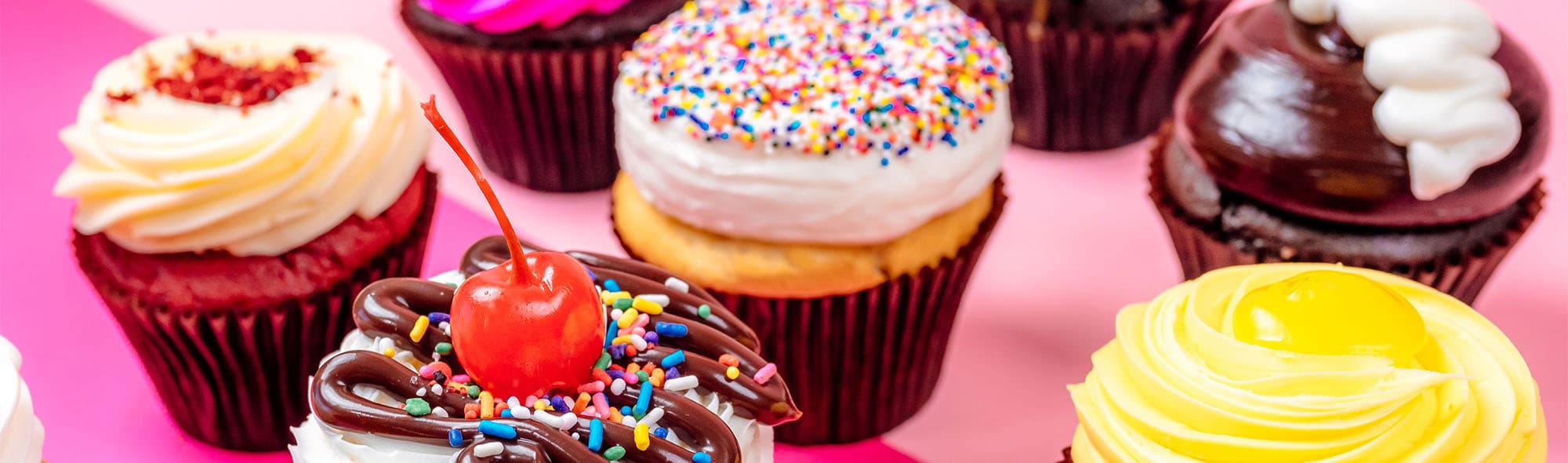 Ice cream cones and cupcake-topped sundaes with Smallcakes branding