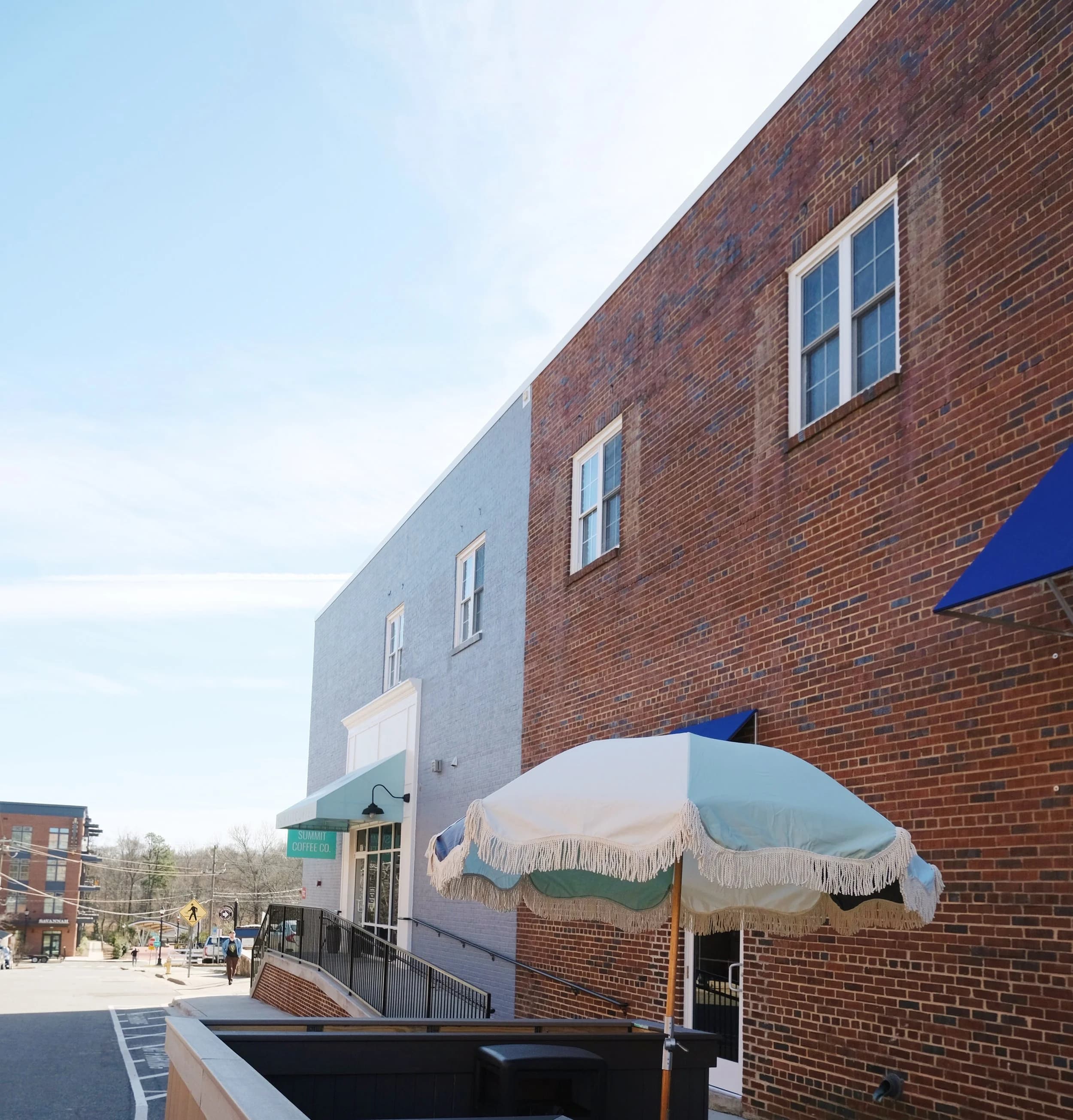 Brick building exterior with Summit Coffee Co. entrance sign