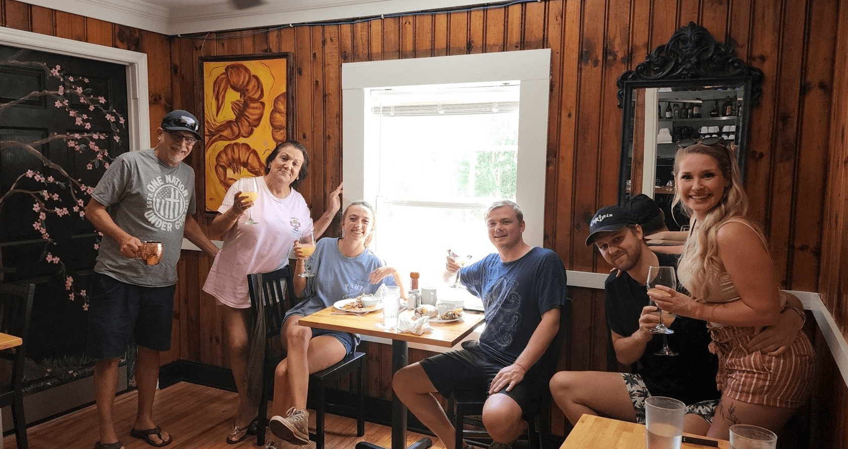 Group toasting drinks on outdoor patio