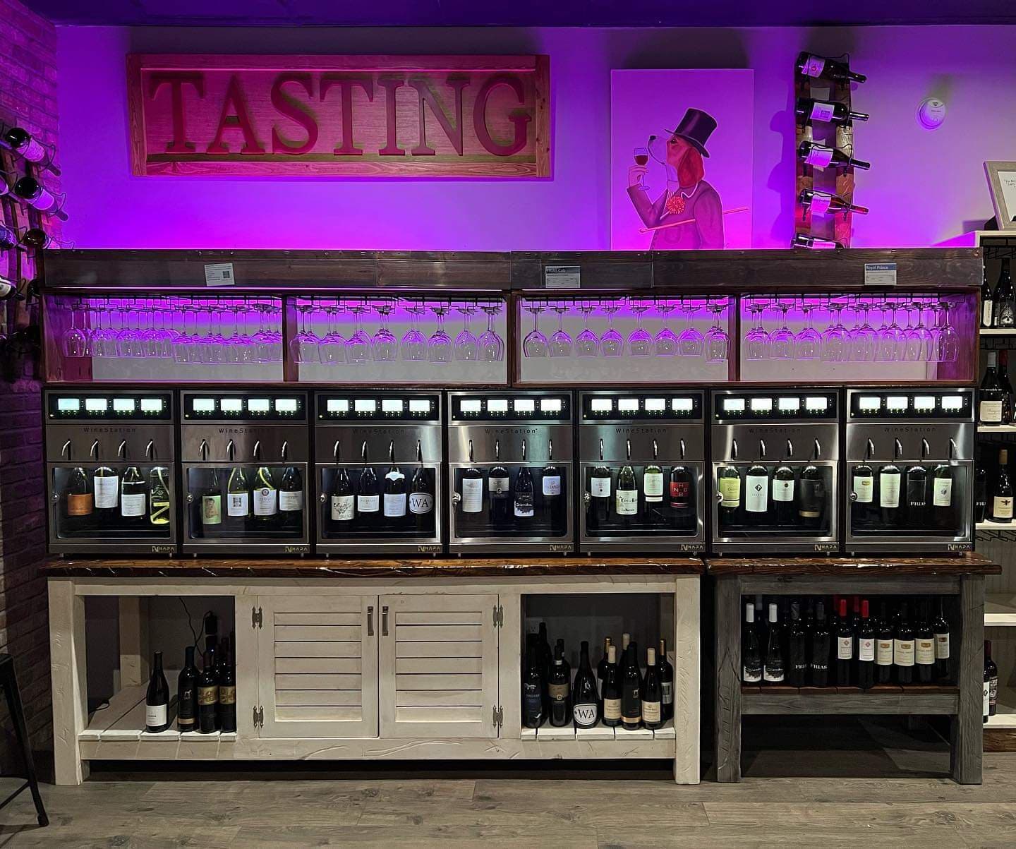 Wine tasting station with dispensers and bottles